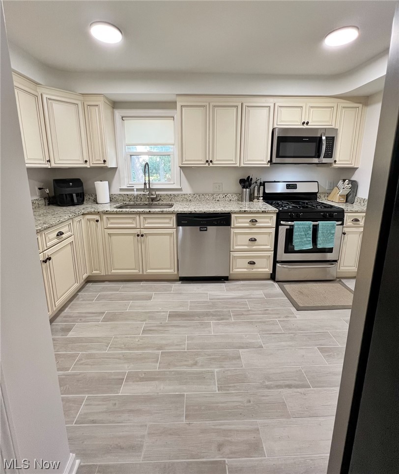 4605 Birchwold Road South Euclid, OH 44121 - Photo 8 of 30 Large, bright kitchen. Tile flooring, soft close kitchen drawers.