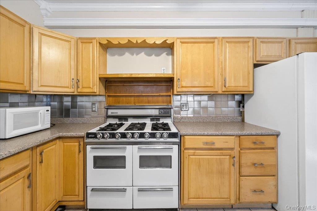 14 Moss Hill Road Holmes, NY 12531 - Photo 14 of 50 a kitchen with a stove and a microwave