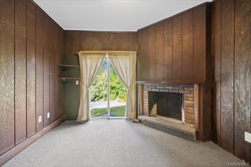 14 Moss Hill Road Holmes, NY 12531 - Photo 20 of 50 a view of an empty room with a fireplace and a window