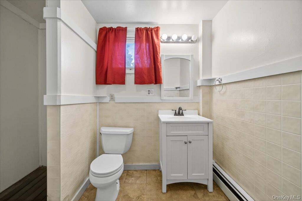 14 Moss Hill Road Holmes, NY 12531 - Photo 22 of 50 a bathroom with a toilet a sink and a window