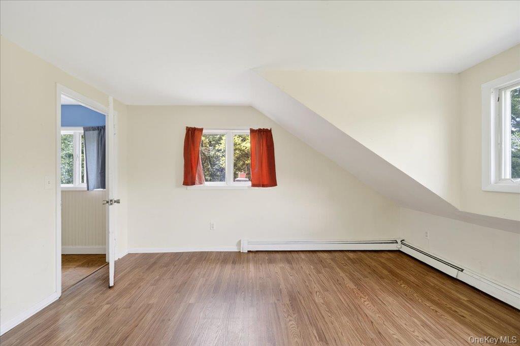 14 Moss Hill Road Holmes, NY 12531 - Photo 28 of 50 an empty room with wooden floor and windows