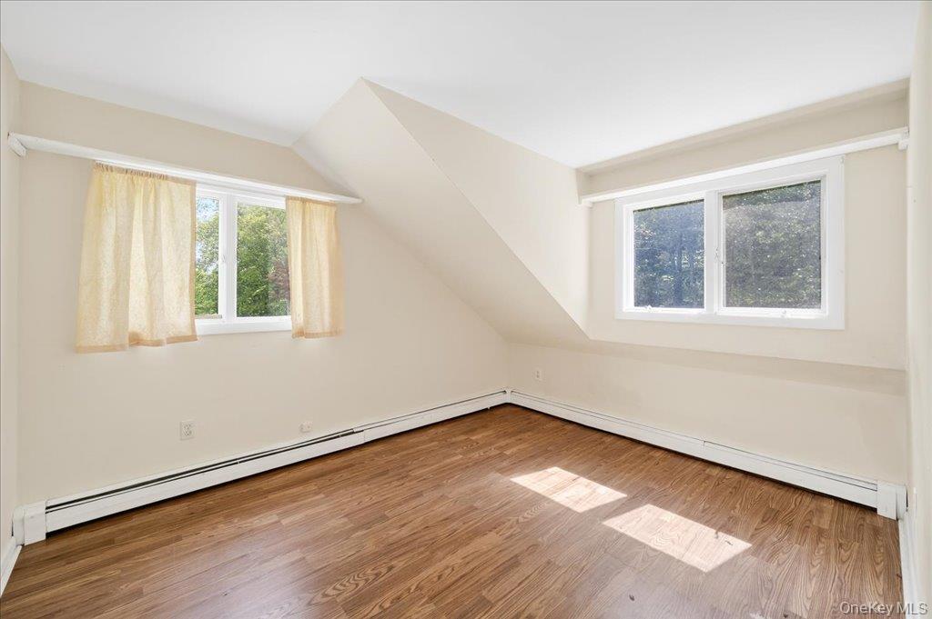 14 Moss Hill Road Holmes, NY 12531 - Photo 31 of 50 an empty room with wooden floor and windows