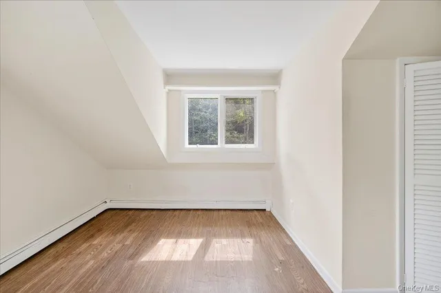 a bathroom with a sink a toilet a mirror and shower