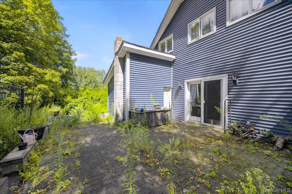 14 Moss Hill Road Holmes, NY 12531 - Photo 45 of 50 a backyard of a house with plants and tree