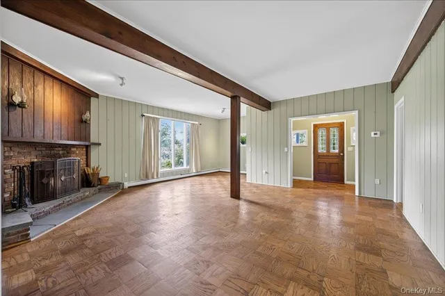 a view of a big room with windows and wardrobe