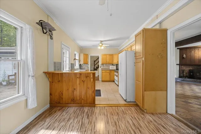 a view of a room with wooden floor and window