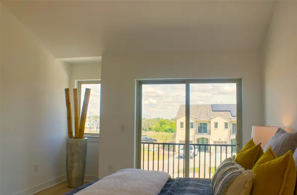 a bedroom with a bed and window