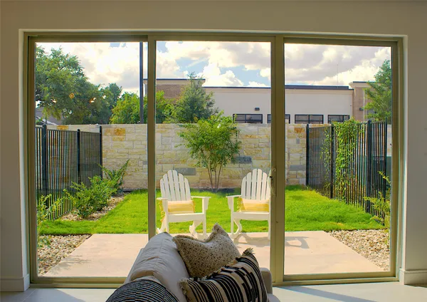 a view of a house with a yard and sitting area