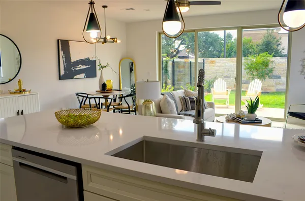 a kitchen with a refrigerator a stove a sink and a refrigerator