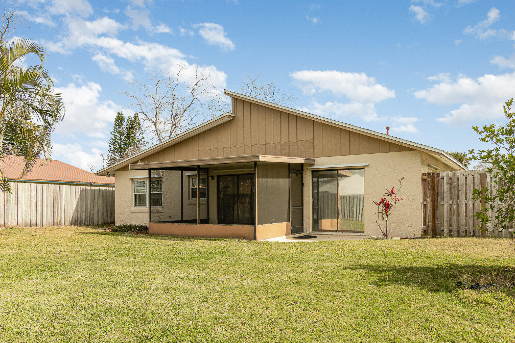 446 Timberlake Drive Melbourne, FL 32940 - Photo 20 of 20 a front view of a house with a garden