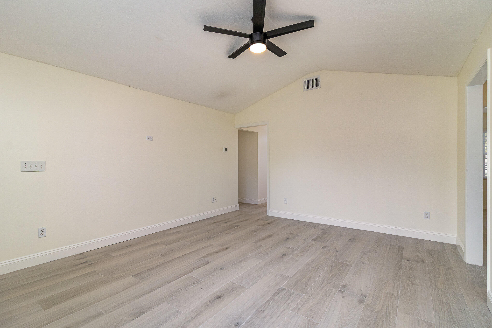 446 Timberlake Drive Melbourne, FL 32940 - Photo 8 of 20 a view of a room with wooden floor