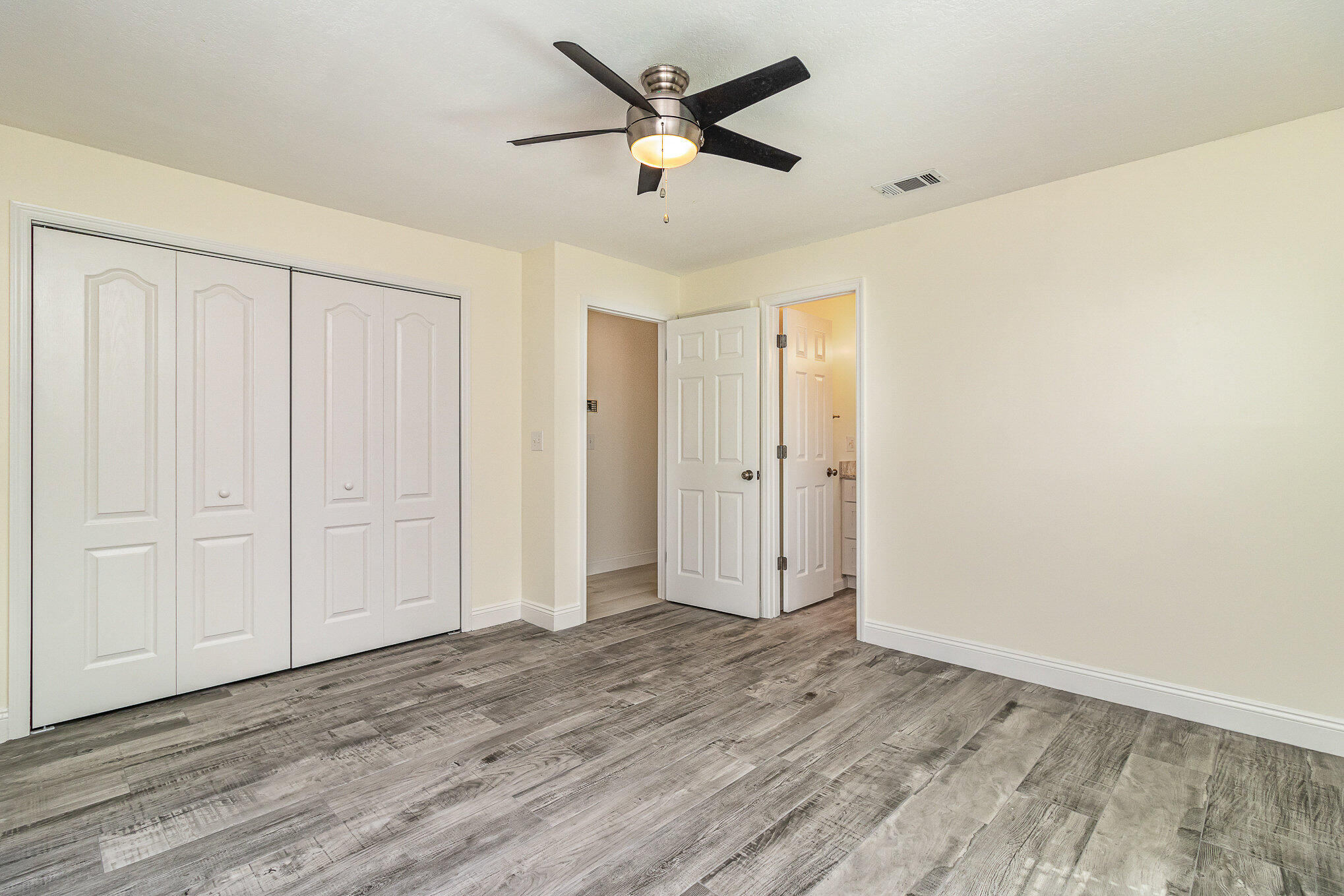 446 Timberlake Drive Melbourne, FL 32940 - Photo 10 of 20 a view of empty room with wooden floor