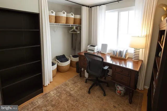 a bathroom with a toilet sink vanity and mirror