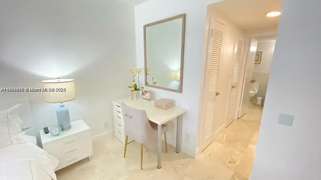 a spacious bathroom with a bathtub sink and mirror