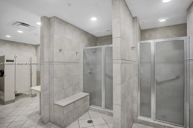a bathroom with a shower and a toilet