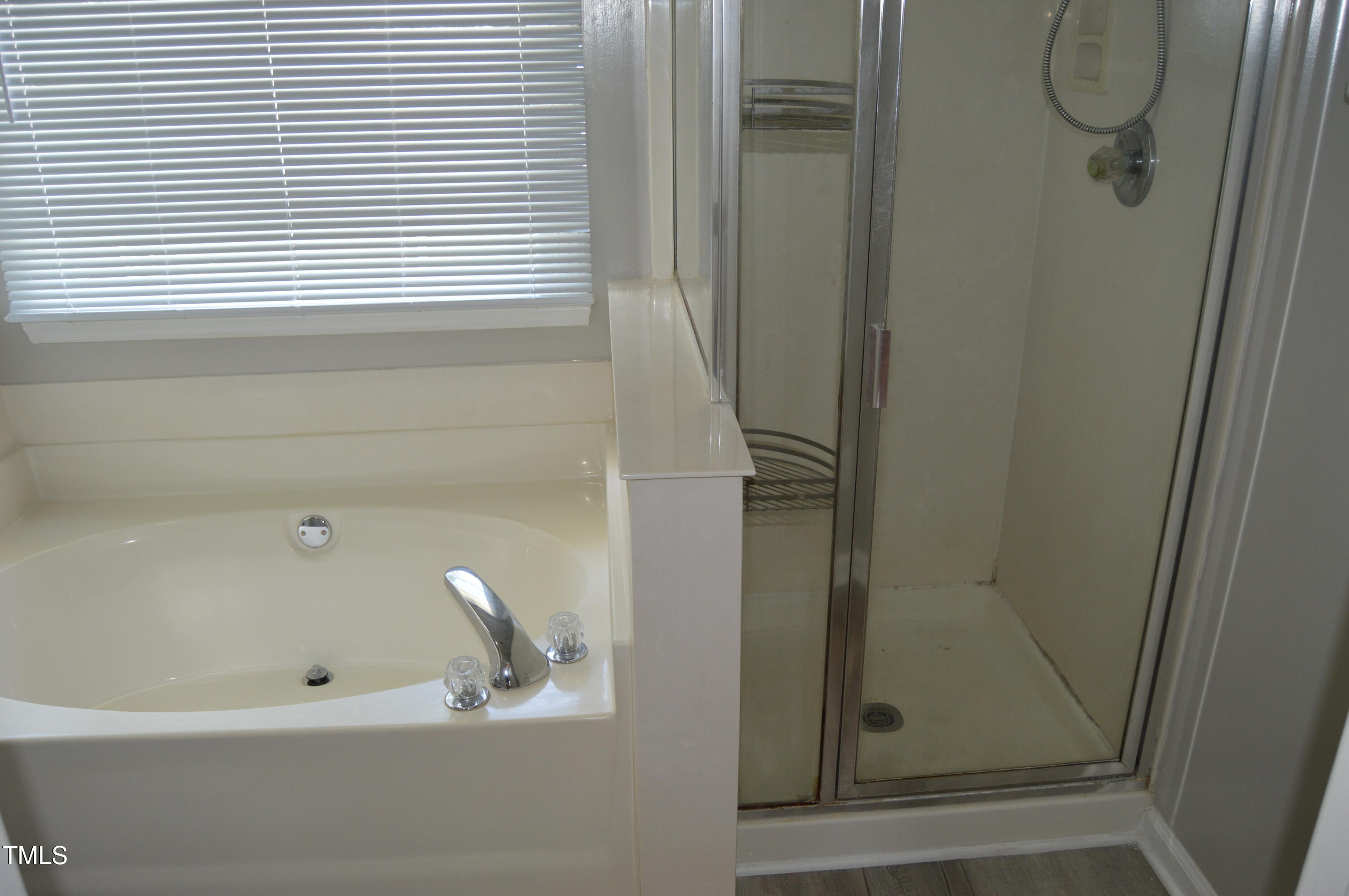 3401 Kensett Way Raleigh, NC 27616 - Photo 20 of 31 a bathroom with a bathtub
