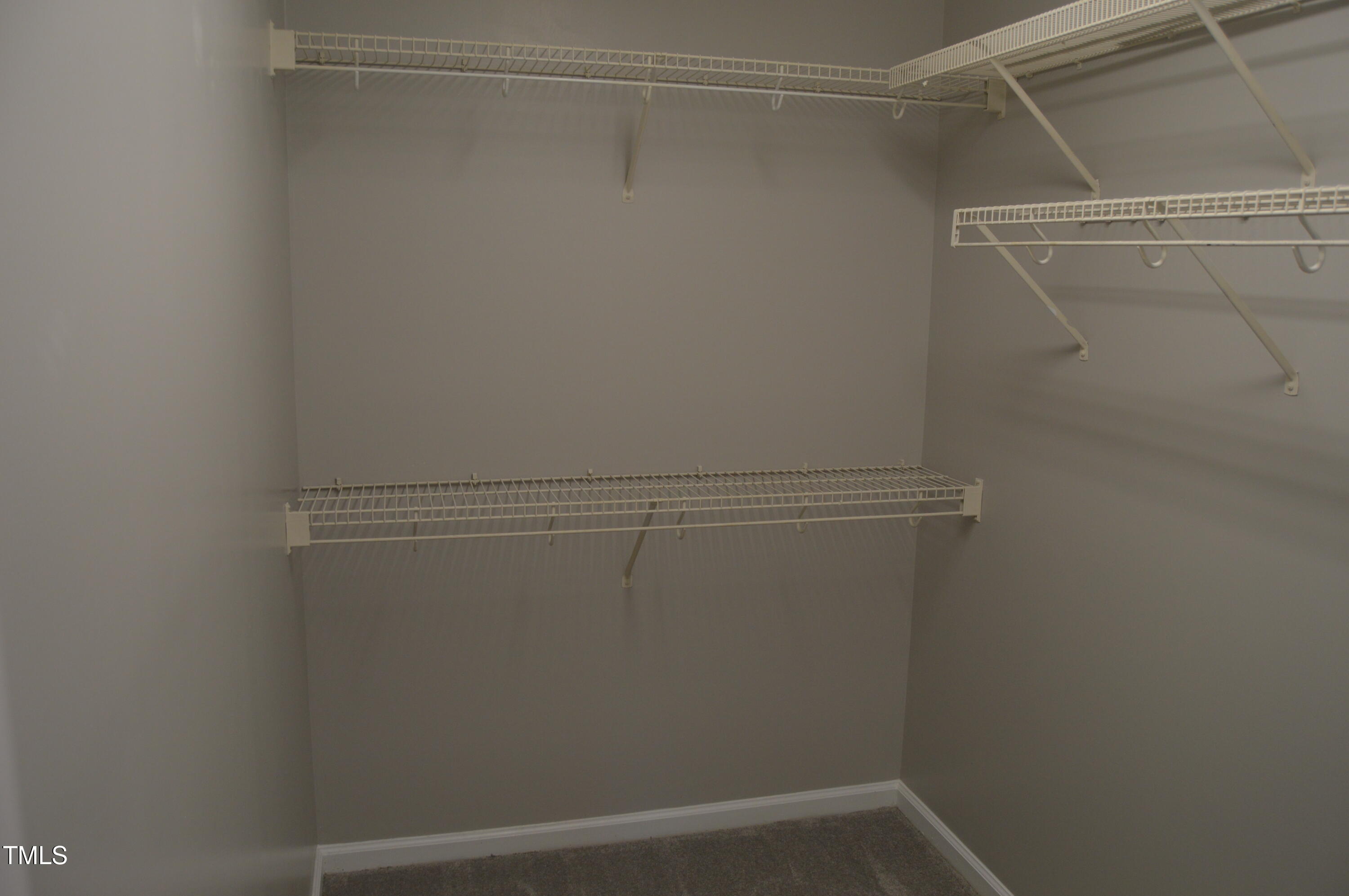 3401 Kensett Way Raleigh, NC 27616 - Photo 23 of 31 a view of a room with racks on the wall