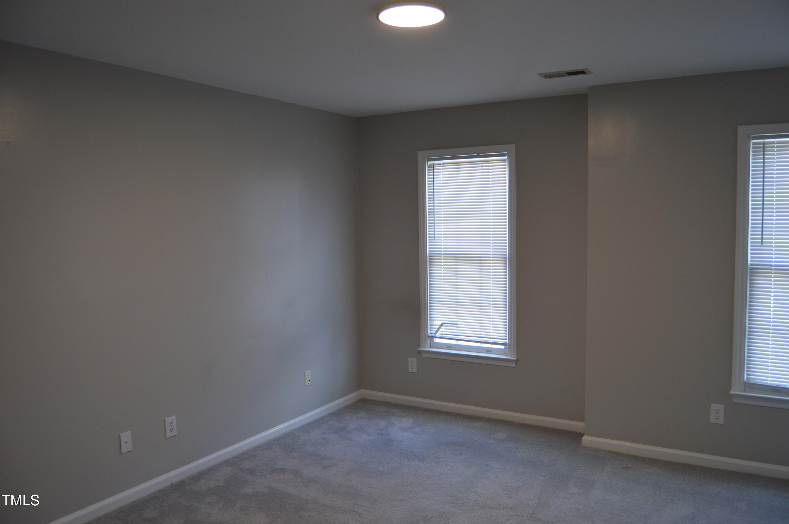 3401 Kensett Way Raleigh, NC 27616 - Photo 26 of 31 an empty room with windows