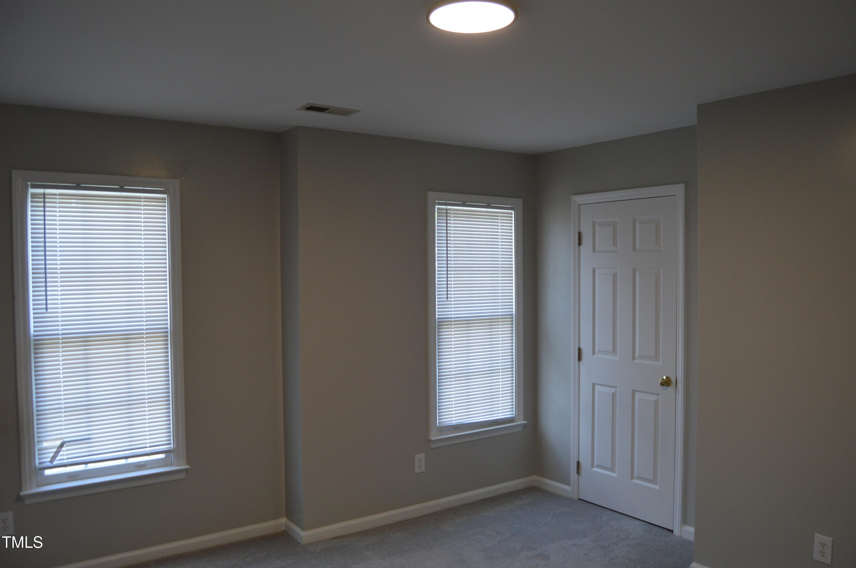 3401 Kensett Way Raleigh, NC 27616 - Photo 27 of 31 an empty room with windows