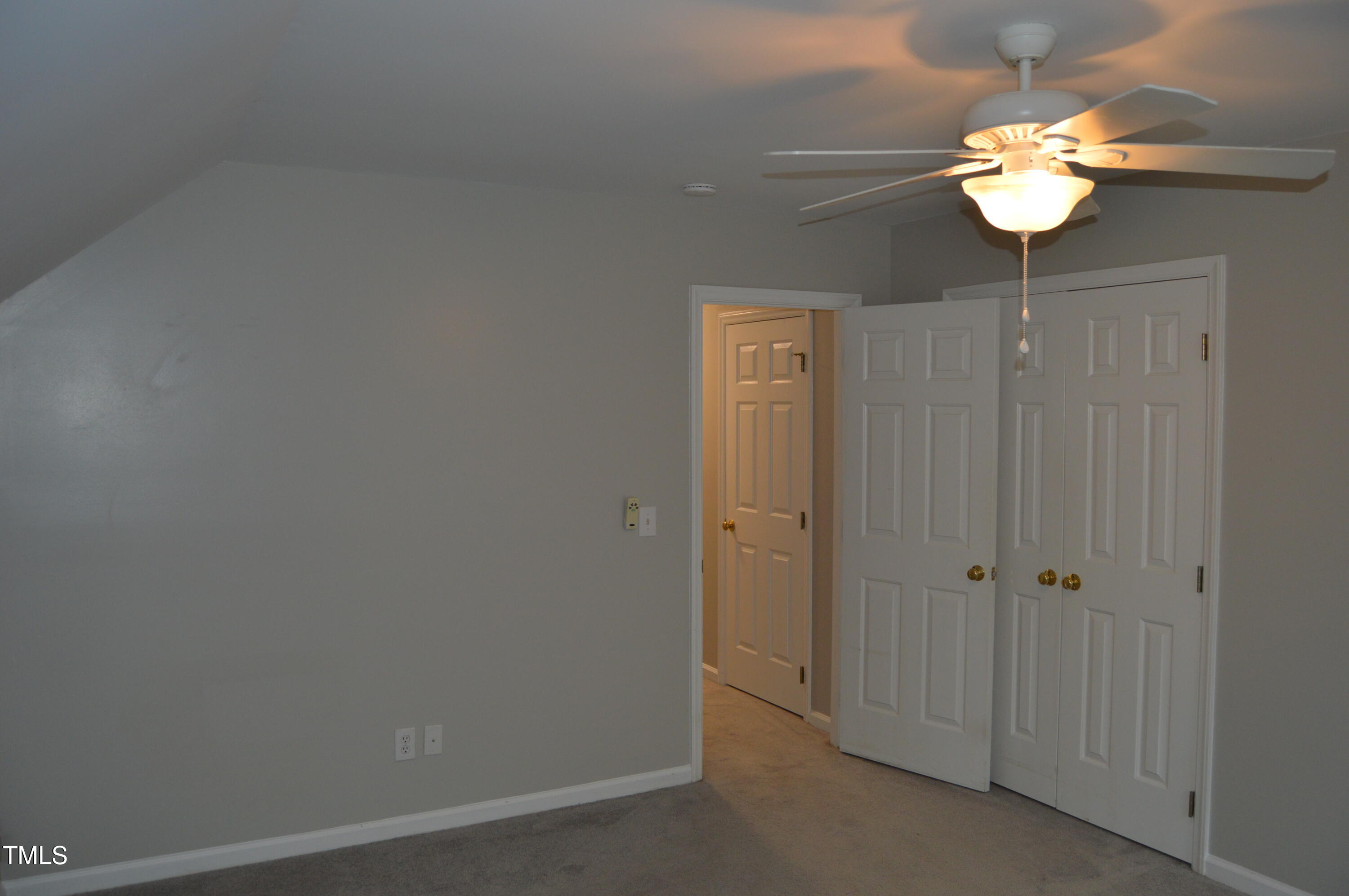 3401 Kensett Way Raleigh, NC 27616 - Photo 31 of 31 a view of a chandelier fan and closet in a room