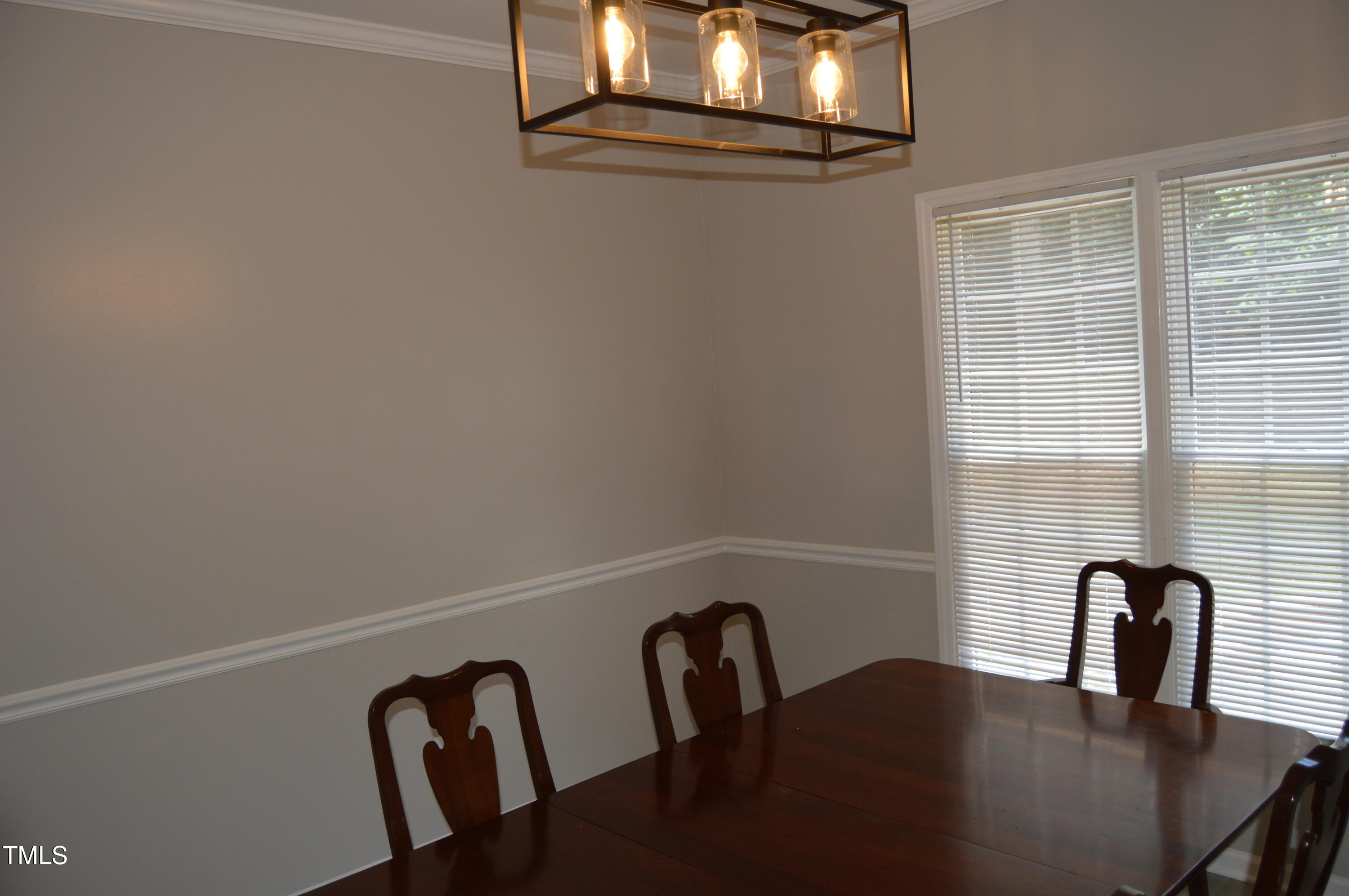 3401 Kensett Way Raleigh, NC 27616 - Photo 9 of 31 a view of a dining room with furniture and window
