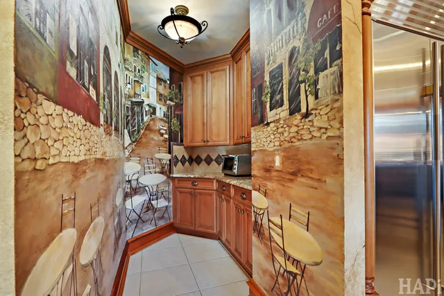 a living room with furniture a fireplace and a floor to ceiling window