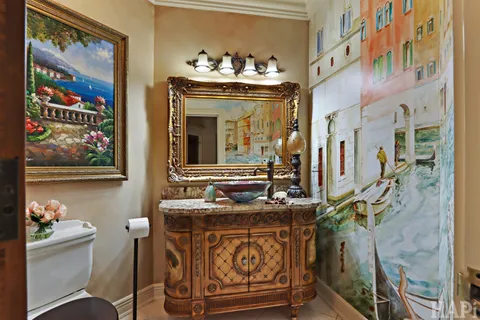 a view of a hallway with wooden floor and entryway