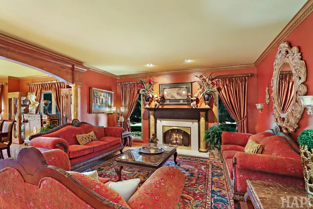 a bathroom with a granite countertop sink a large mirror and a shower