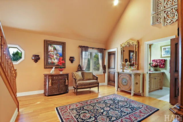 a living room with furniture ceiling fan and a rug