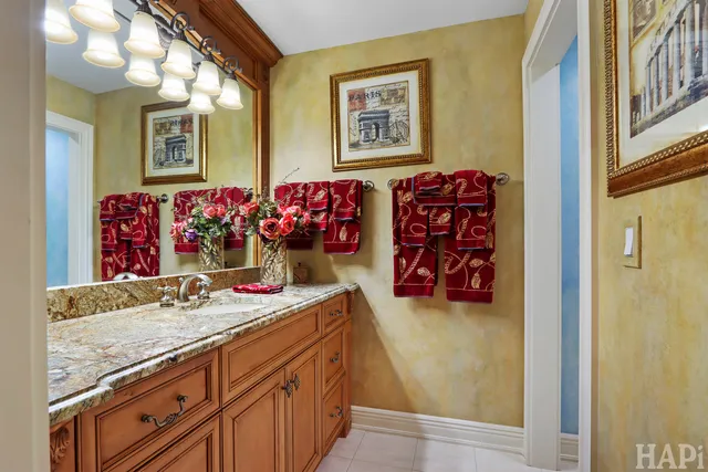 an aerial view of a house with a yard and greenery