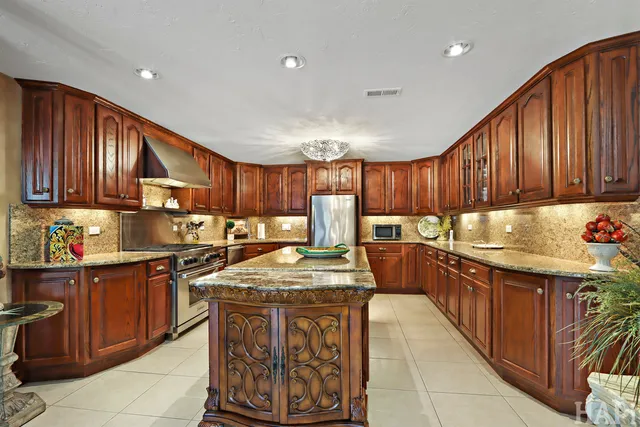 a front view of a house with a garden and a yard