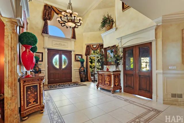 a kitchen with stainless steel appliances granite countertop a refrigerator and a stove