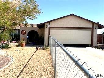 a view of the house with a yard