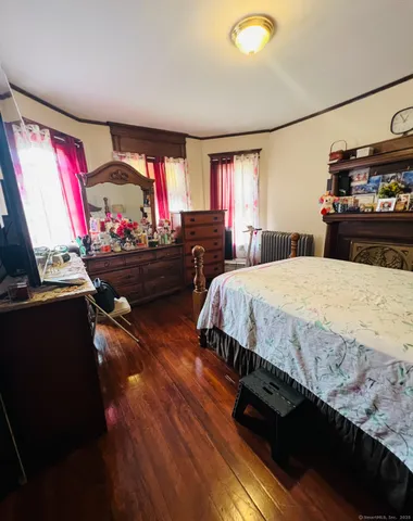 a bedroom with bed and window