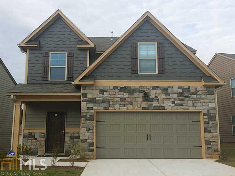 4864 Longview Run, Unit 26 Decatur, GA 30035 - Photo 1 of 1 a front view of a house with a garage