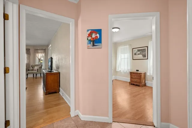 a view of a hallway with living room and furniture