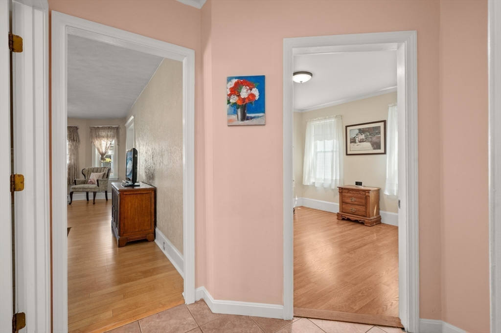 76 Windsor Road, Unit 1 Medford, MA 02155 - Photo 20 of 32 a view of a hallway with living room and furniture