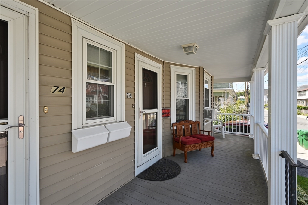 76 Windsor Road, Unit 1 Medford, MA 02155 - Photo 3 of 32 a view of a balcony with chairs and wooden floor