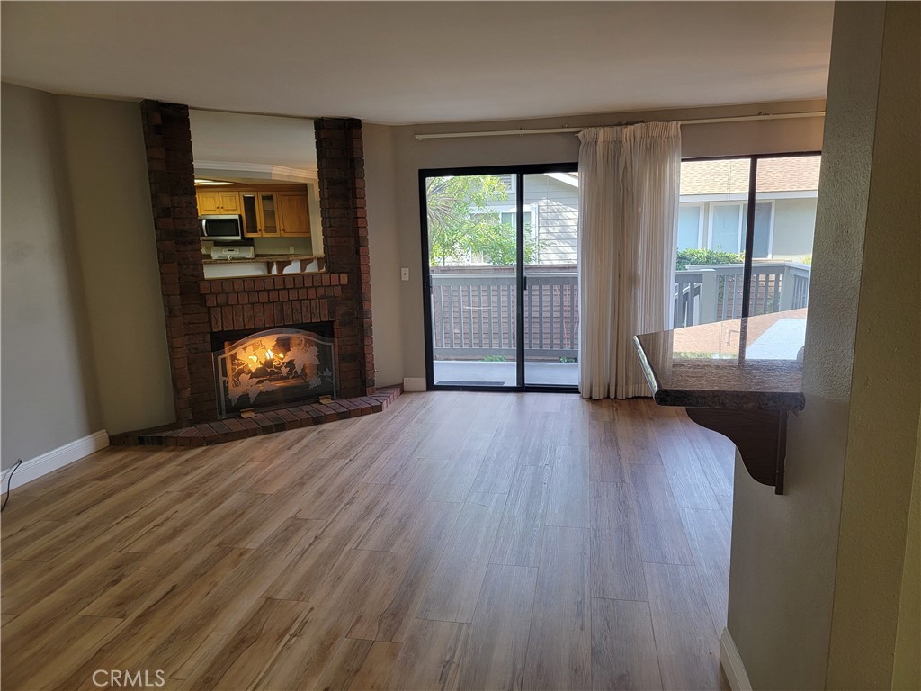 941 Lotus Circle San Dimas, CA 91773 - Photo 12 of 25 wooden floor in an empty room with a window