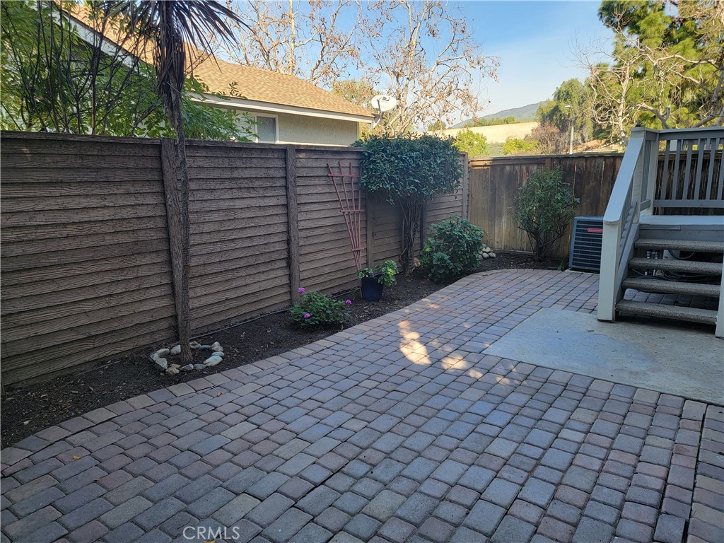 941 Lotus Circle San Dimas, CA 91773 - Photo 22 of 25 a front view of a house with a yard