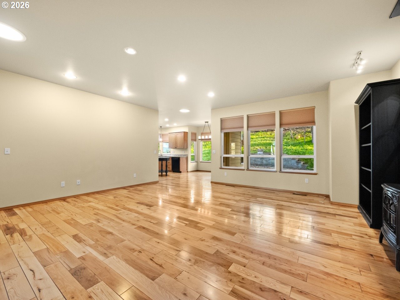 1101 B Avenue La Grande, OR 97850 - Photo 5 of 35 a view of an empty room with a window and wooden floor