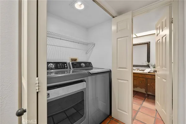a kitchen with stainless steel appliances granite countertop a stove and a refrigerator