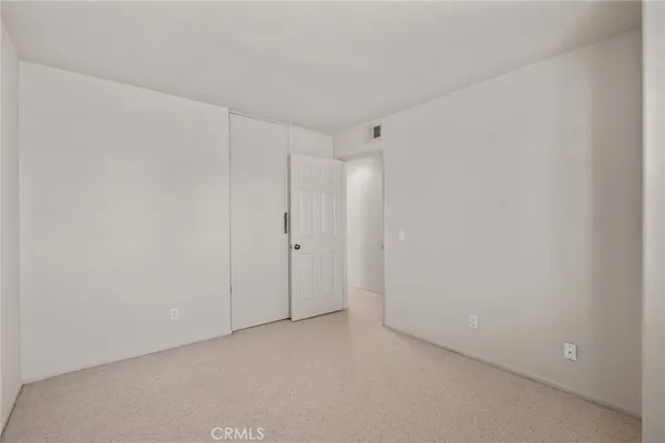 a view of a workspace with furniture and a potted plant