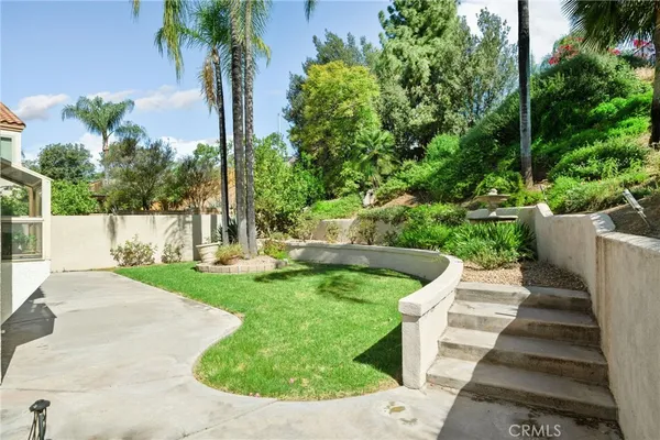 a view of a garden with a fountain