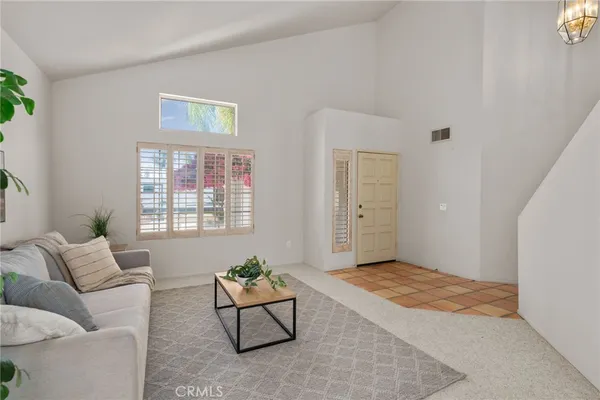 a living room with furniture and window