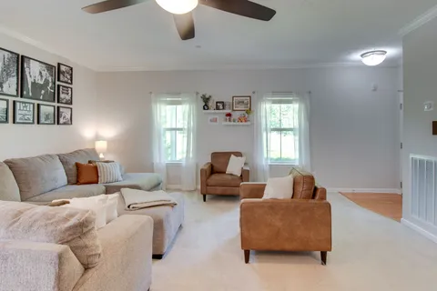 a living room with furniture and a fireplace