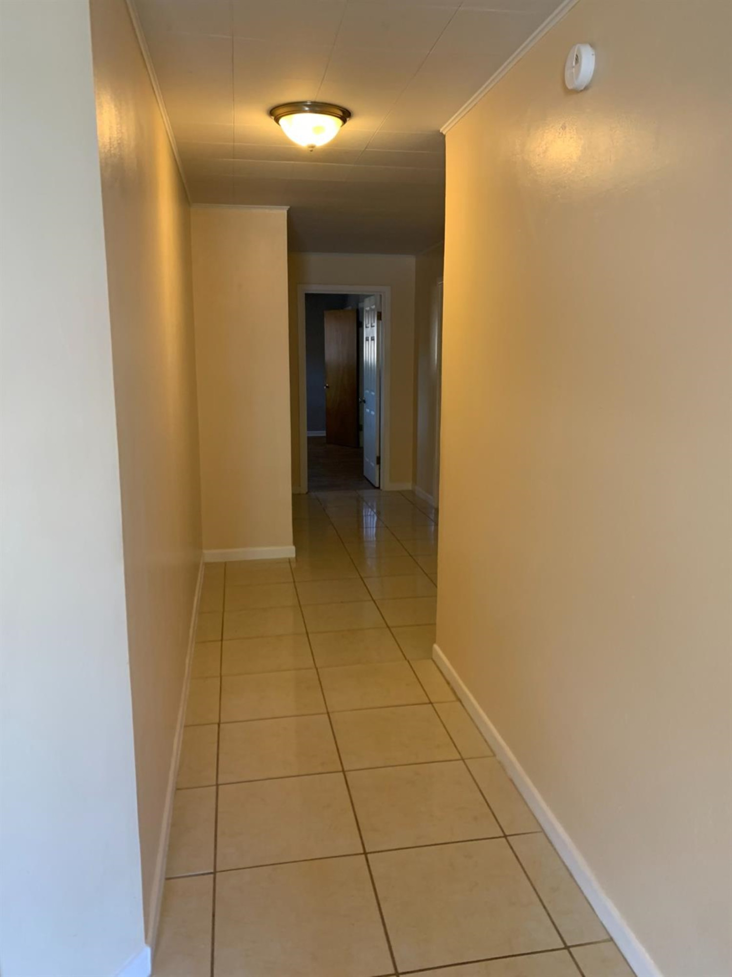 2812 56th Street Lubbock, TX 79413 - Photo 9 of 14 a view of hallway with a bathroom and mirror