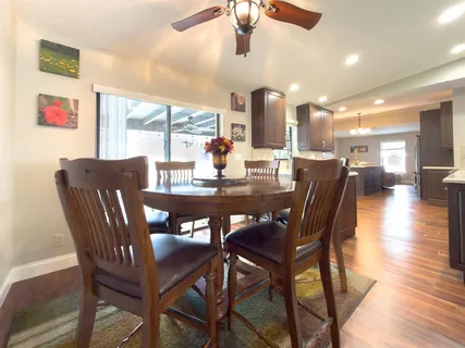 a kitchen with stainless steel appliances kitchen island granite countertop a sink counter space and cabinets