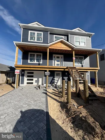 a front view of a building with many windows