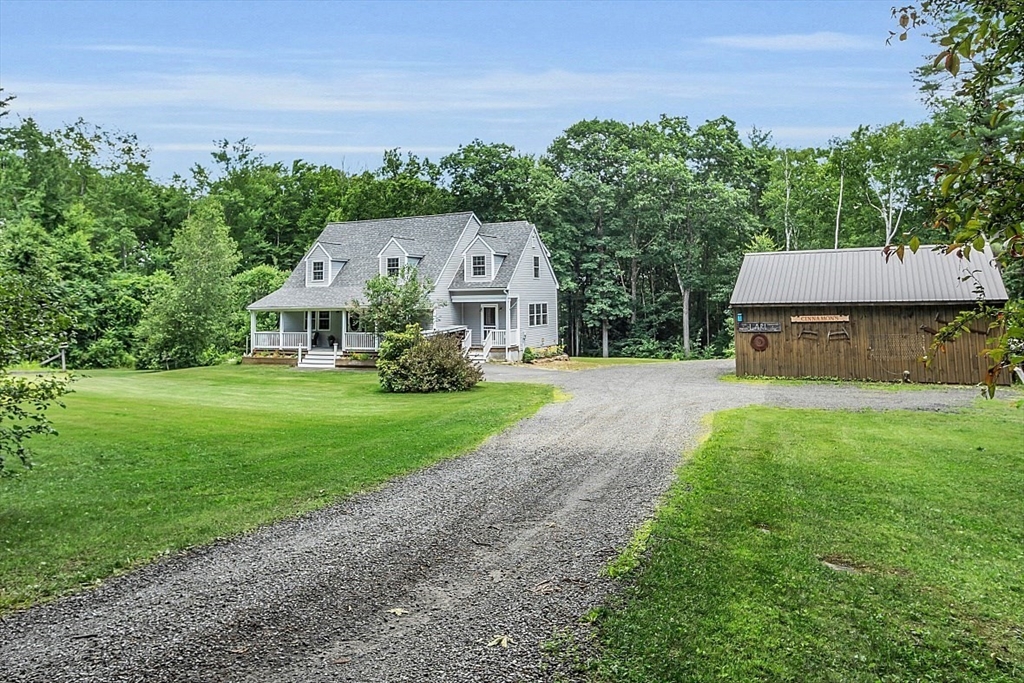 371 Walnut Hill Road Orange, MA 01364 - Photo 1 of 41 a front view of a house with garden
